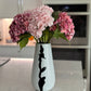 Black white accent vase

Modern vase for entryway

Compact black and white vase

Artistic minimalist vase

Ceramic vases for modern homes

Home styling vase

Designer home decor vase

Vase for dried stems

Small ceramic flower vase

Decorative accent vase