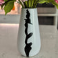 Black white accent vase

Modern vase for entryway

Compact black and white vase

Artistic minimalist vase

Ceramic vases for modern homes

Home styling vase

Designer home decor vase

Vase for dried stems

Small ceramic flower vase

Decorative accent vase
