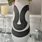 Black white sculptural vase

17 inch home accent vase

Shelf styling ceramic vase

Modern artistic vase

Statement piece vase

Neutral tone ceramic vase

Vase for faux flowers modern

Modern interior accent piece

Black and white minimalist décor

Luxury ceramic decorative vase