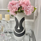 Black and white ceramic vase

Modern monochrome vase

17 inch tall decorative vase

Minimalist black and white vase

Two-tone ceramic vase

Black and white home decor vase

Sculptural ceramic vase

Contemporary decorative vase

Large black and white vase

Modern vase for shelf decor